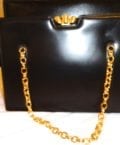 SAKS FIFTH AVE-BLACK LEATHER HANDBAG-GOLD CLOSURE AND CHAIN STRA